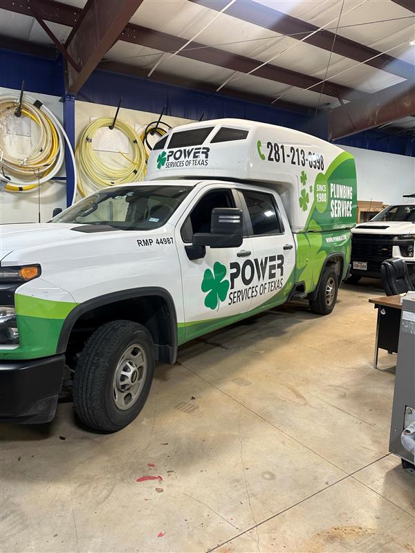 Power plumbing servcies signage on truck